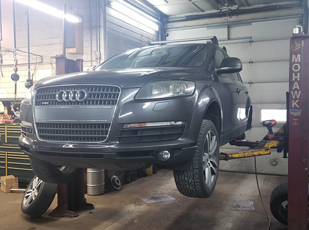 European vehicle in a service bay at an auto repair shop