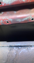 Exhaust pipe with soot marks indicating a leak at a joint