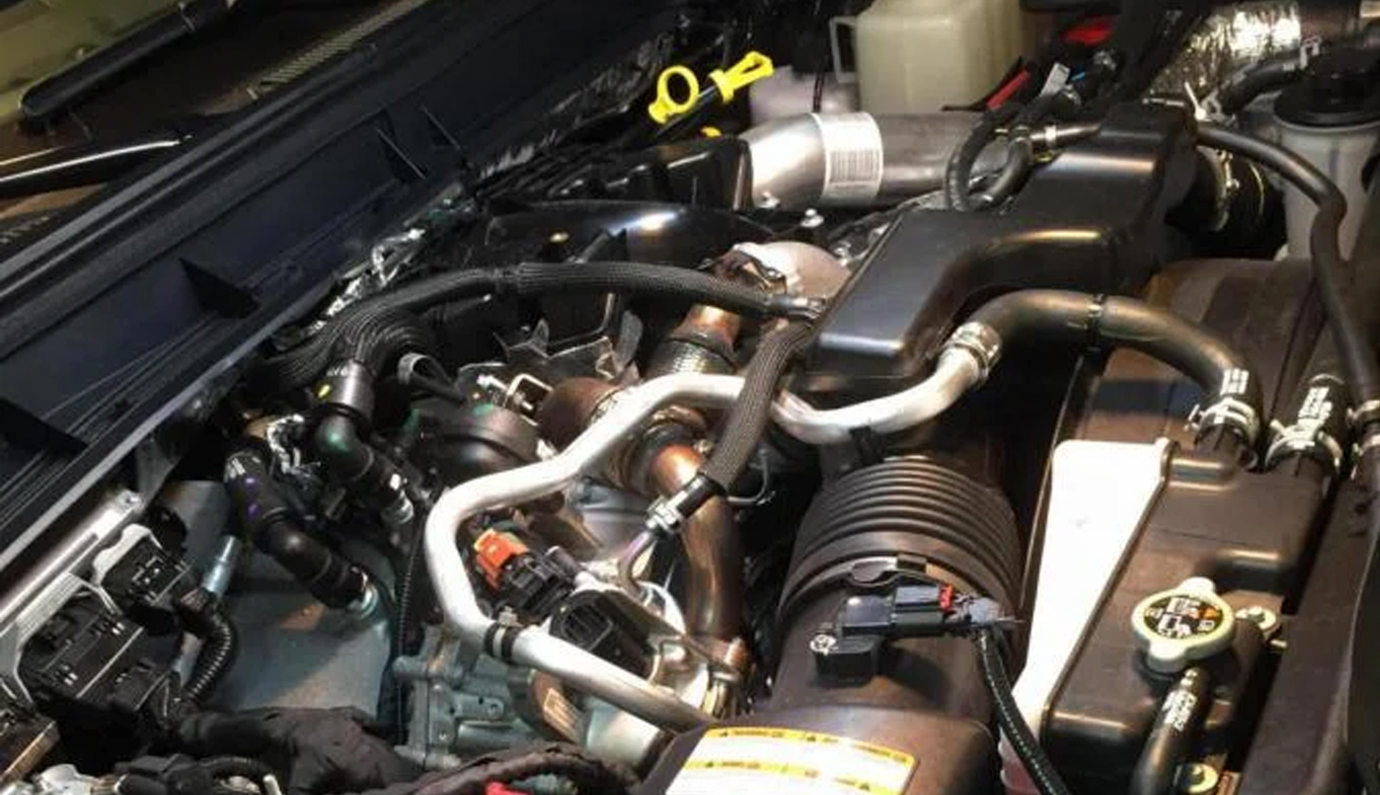 Technician performing Power Stroke diesel diagnostics on a Ford truck