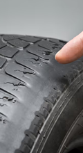 Uneven tire wear pattern on tread